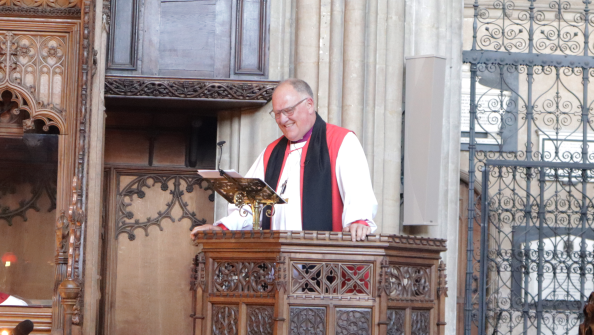 Bishop Neil preaching (smile).png