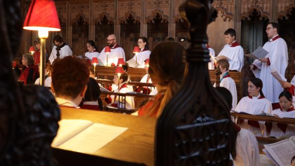 Choir singing in choir stalls.JPG