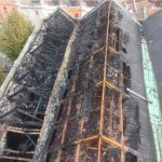 Aerial view of fire damaged roof of St Michael on the Mount without